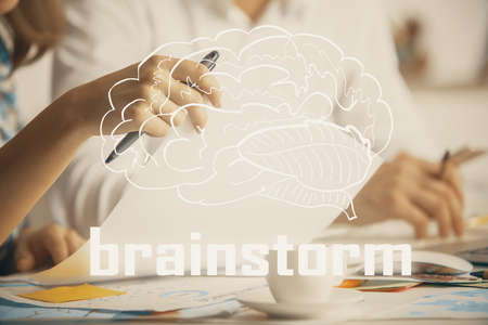 Double exposure of creative drawing over people taking notes background. concept of startup