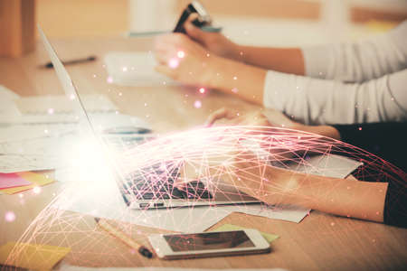 Double exposure of woman hands typing on computer and social network theme hologram drawing. people media concept.の写真素材
