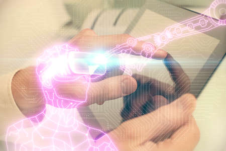Double exposure of man's hands holding and using a digital device and AR glasses drawing. Virtual...