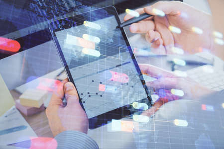 Multi exposure of man's hands holding and using a digital device and data theme drawing. Innovation...