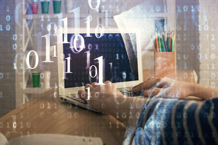 Double exposure of woman hands working on computer and data theme hologram drawing. Tech concept.
