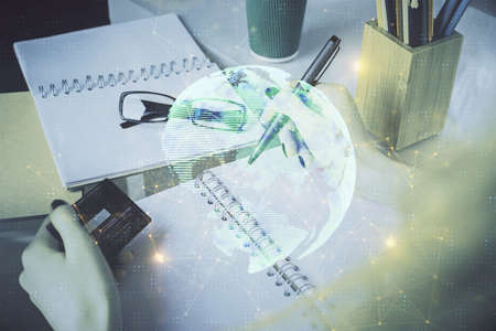 Multi exposure of woman on-line shopping holding a credit card and social network theme drawing. Relationship E-commerce concept.の写真素材