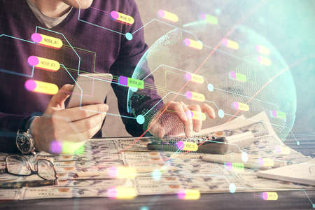Multi exposure of man's hands holding and using a digital device and map drawing. International...