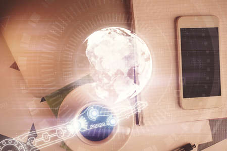 Double exposure of map hologram drawing over desktop. Top view. International connection concept.