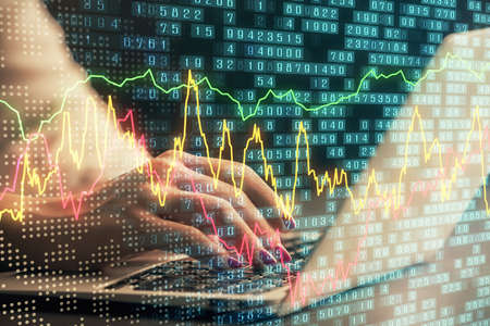 Double exposure of businesswoman hands typing on computer and forex chart hologram drawing....