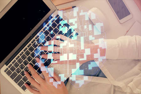 Double exposure of woman hands working on computer and data theme hologram drawing. Top View....