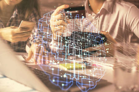 Double exposure of man and woman on-line shopping holding a credit card and brain hologram drawing....