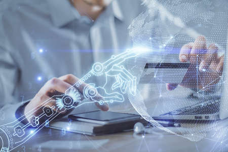 Double exposure of man hands holding a credit card and tech theme drawing. Technology in E-commerce...