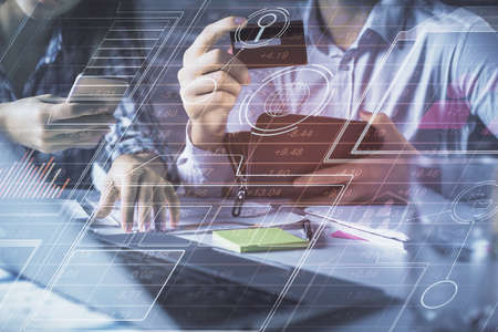 Double exposure of man and woman on-line shopping holding a credit card and data theme hologram...
