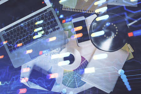 Multi exposure of data theme drawing hologram over topview work desk background with computer....