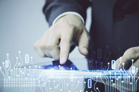 Multi exposure of man's hand holding and using a digital device and data theme drawing. Innovation...