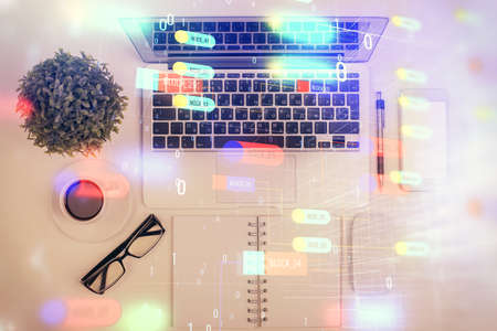 Double exposure of data drawing hologram over topview of study desk background with computer. Concept of Ai.の写真素材