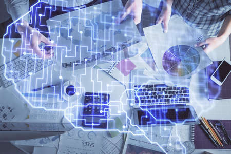 Double exposure of man and woman working together and human brain hologram drawing. Brainstorm concept. Computer background. Top View.の写真素材