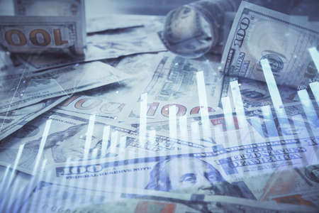 Multi exposure of forex chart drawing over us dollars bill background. Concept of financial success markets.の写真素材