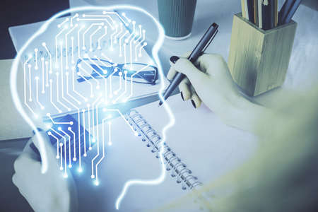 Double exposure of woman on-line shopping holding a credit card and brain hologram drawing. Data...