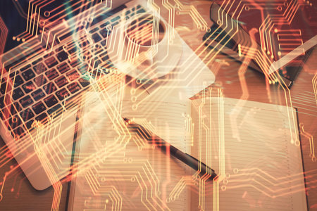 Technology hologram drawing over computer on the desktop background. Top view. Double exposure. Tech...