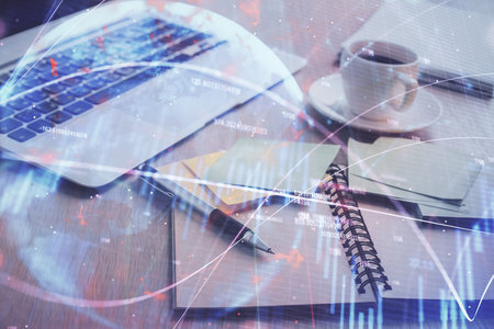 Multi exposure of forex graph drawing and desktop with coffee and items on table background. Concept of financial market tradingの写真素材