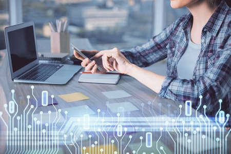 Multi exposure of woman hands working on computer and data theme hologram drawing. Tech concept.の写真素材