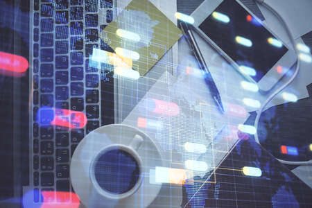 Double exposure of data drawing hologram over topview of study desk background with computer....