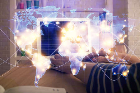 Double exposure of woman hands typing on computer and business theme hologram drawing. Success...