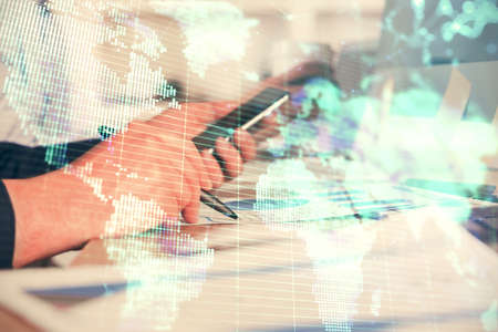 Double exposure of man's hands holding and using a phone and international business theme drawing.