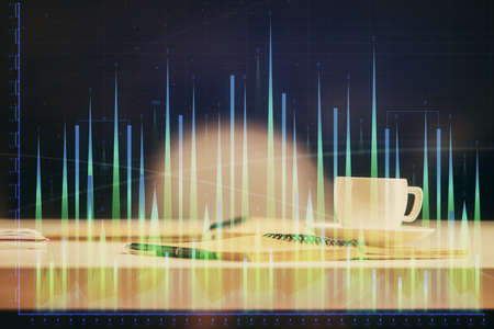 Multi exposure of forex graph drawing and desktop with coffee and items on table background. Concept...