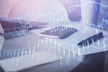 Double exposure of forex graph drawing and cell phone background. Concept of financial data analysisの写真素材
