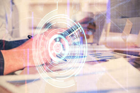 Multi exposure of man's hands holding and using a digital device and data theme drawing. Innovation...