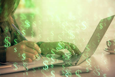 Double exposure of businesswoman hands typing on computer and forex graph hologram drawing. Financial analysis concept.の写真素材