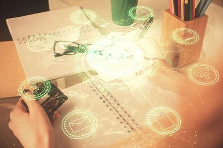 Multi exposure of woman on-line shopping holding a credit card and social network theme drawing. Relationship E-commerce concept.の写真素材