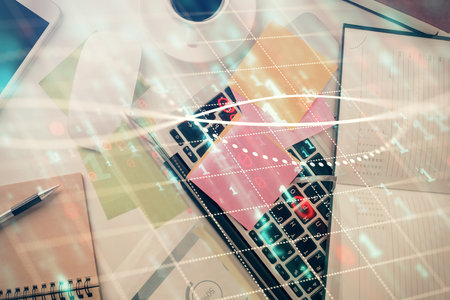 Multi exposure of financial chart drawing over table background with computer. Concept of research and analysis. Top view.の写真素材