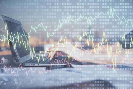 Double exposure of businesswoman hands typing on computer and forex chart hologram drawing....