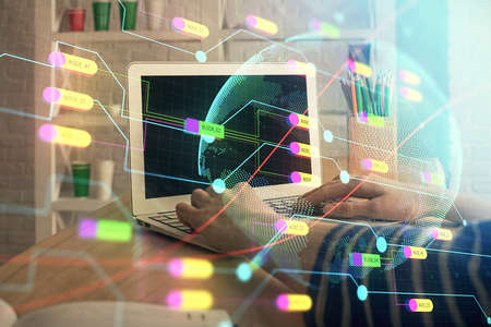 Double exposure of woman hands working on computer and world map hologram drawing. International...