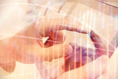Multi exposure of man's hands holding and using a phone and financial chart drawing. Market analysis...