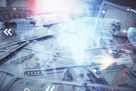 Double exposure of world map drawing over us dollars bill background. International concept.の写真素材