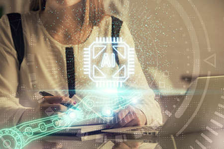 Multi exposure of woman hands working on computer and data theme hologram drawing. Tech concept.の写真素材
