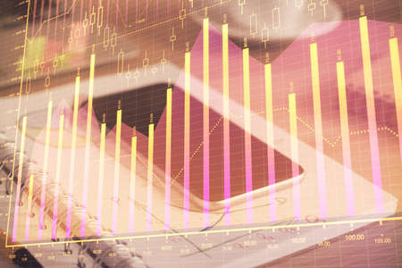 Double exposure of forex chart drawing and cell phone background. Concept of financial data analysisの写真素材