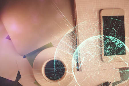 Double exposure of social network theme drawing over table with phone. Top view. People connecting...
