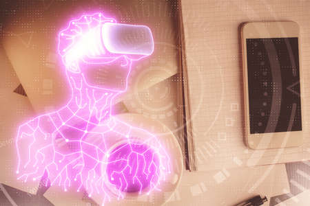 Double exposure of drawing man in AR glasses over table with phone. Top view. VR concept.