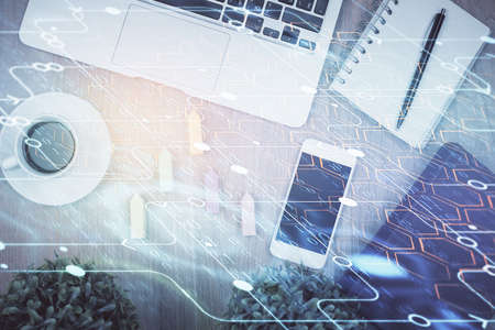 Double exposure of technology theme drawing over work table desktop. Top view. Global data analysis concept.の写真素材