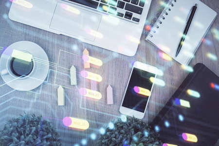 Double exposure of technology theme drawing over work table desktop. Top view. Global data analysis concept.の写真素材