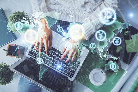 Double exposure of woman hands working on computer and forex chart hologram drawing. Top View....