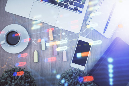 Double exposure of technology theme drawing over work table desktop. Top view. Global data analysis concept.の写真素材