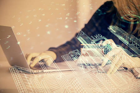 Multi exposure of woman on-line shopping holding a credit card and construction drawing. e-commerce concept.の写真素材
