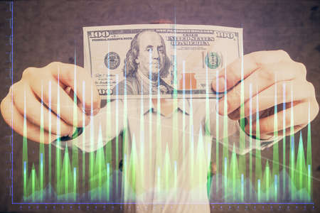 Multi exposure of forex graph drawing hologram and USA dollars bills and man hands. Technical Analysis concept.の写真素材