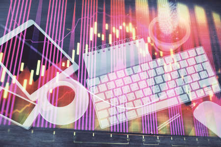 Double exposure of forex chart hologram over desktop with phone. Top view. Mobile trade platform concept.の写真素材