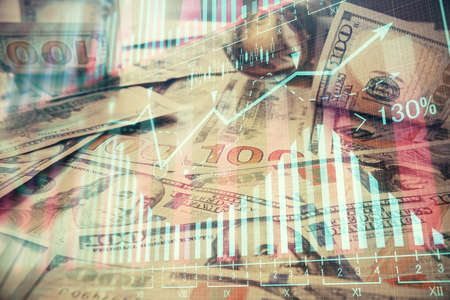 Multi exposure of forex chart drawing over us dollars bill background. Concept of financial success markets.の写真素材
