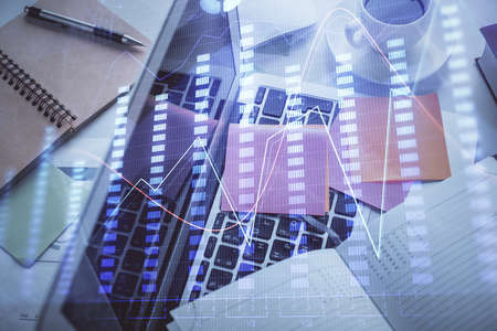Multi exposure of financial chart drawing over table background with computer. Concept of research...