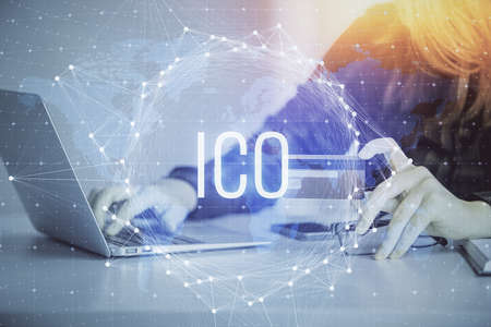 Multi exposure of woman on-line shopping holding a credit card and crypto theme drawing. Blockchain...