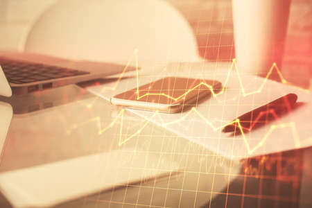 Double exposure of forex graph drawing and cell phone background. Concept of financial data analysis
